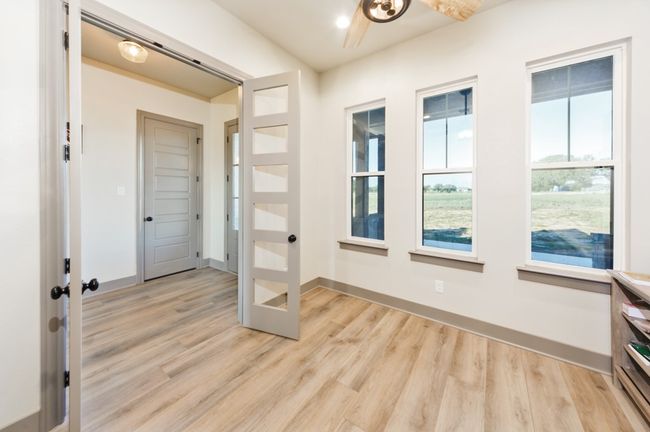 Doorway to outside with french doors, light wood finished floors, and baseboards | Image 14