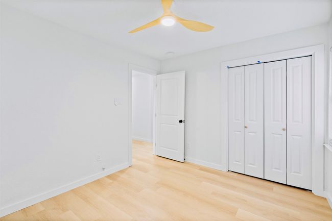 Unfurnished bedroom featuring light wood-style flooring, a closet, and ceiling fan | Image 31