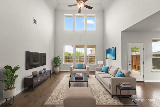 Looking into the backyard from the living room. Here you can see the back door and the dining area | Image 11