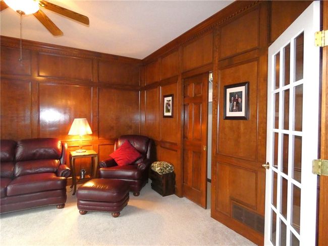 The den features a large walk in closet w/pocket door | Image 13