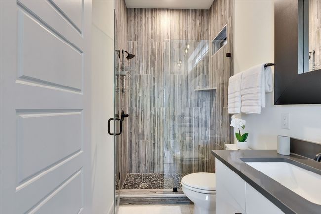 Bathroom featuring vanity and a shower stall | Image 30