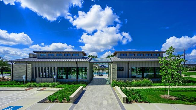 The heart of the community is the Axis Amenity Center where residents can meet up with friends, enjoy a day by the pool, use the fitness center and hang out by the outdoor fireplace. | Image 23