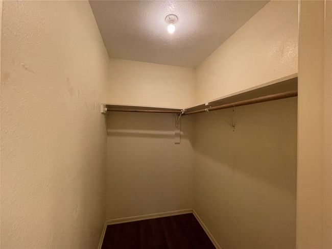Spacious closet featuring dark wood-type flooring | Image 20