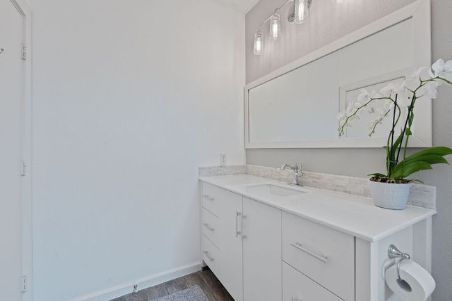 Bathroom with wood finished floors and vanity | Image 17