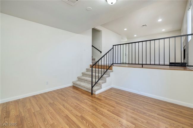 Staircase with wood finished floors and recessed lighting | Image 7