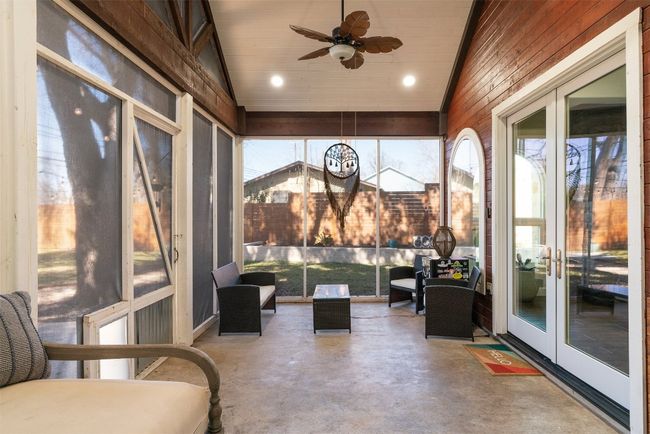 The screened-in patio is not only a great space for lounging but also offers additional entertainment opportunities | Image 24