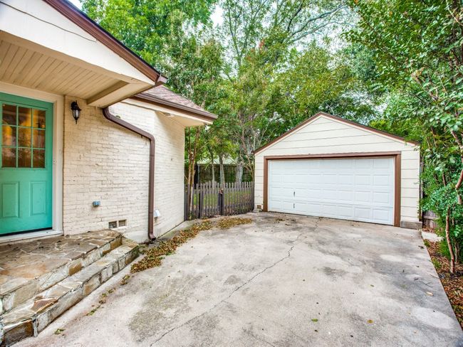 Detached garage featuring fence | Image 22