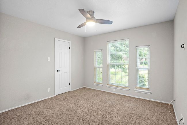 Same room empty to use as bedroom, beautiful view of the large tree in the front yard | Image 21