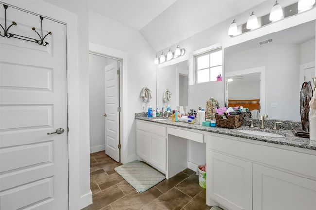 Ensuite bathroom with double vanity and vaulted ceiling | Image 22