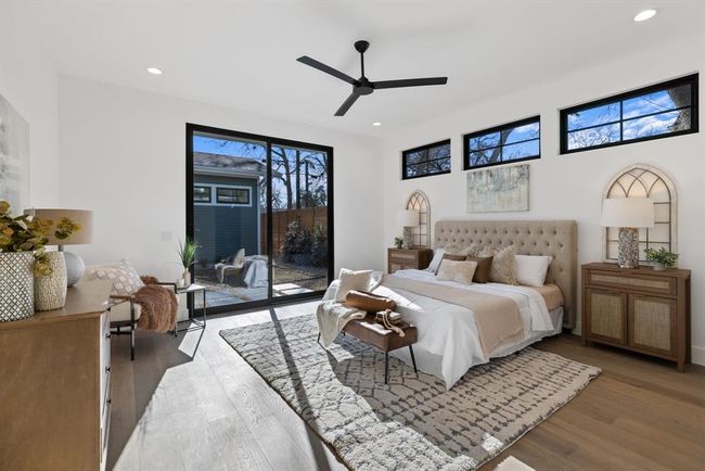 Bedroom with access to exterior, light wood-style floors, recessed lighting, and a ceiling fan | Image 8