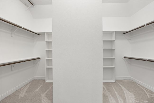 Walk in closet featuring carpet | Image 27