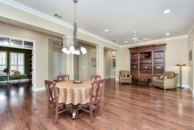 Den is across from dining room. Beautiful engineered hardwood floors. | Image 4
