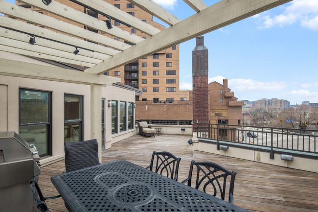 Private rooftop deck with gas fireplace & connected to the home sound system | Image 51