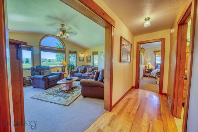 Looking into den/family room and down hallway to guest room | Image 14
