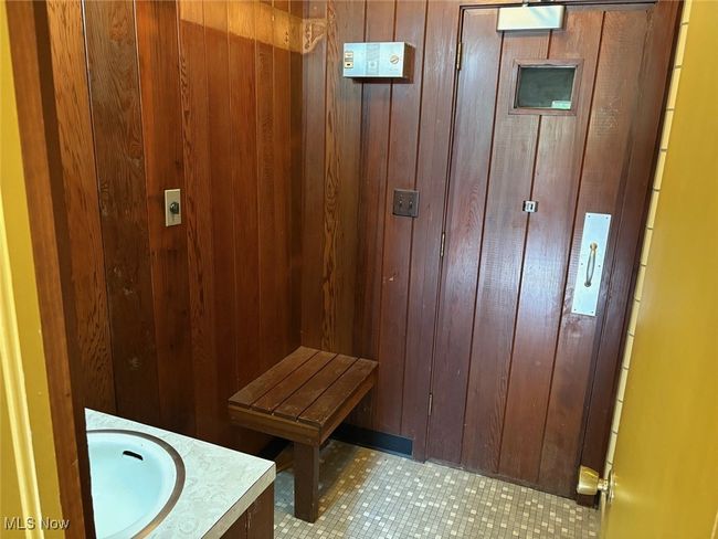 Bathroom featuring a stall shower and sauna | Image 10