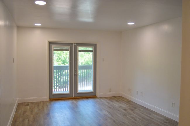 Unfurnished room featuring wood finished floors and recessed lighting | Image 18