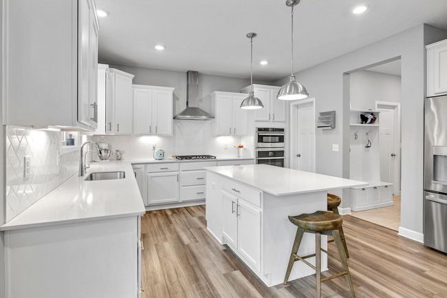 Chef’s kitchen with an expansive island. | Image 7