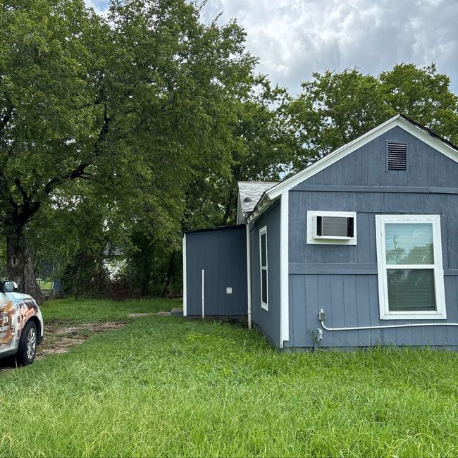 View of property exterior with a lawn | Image 10