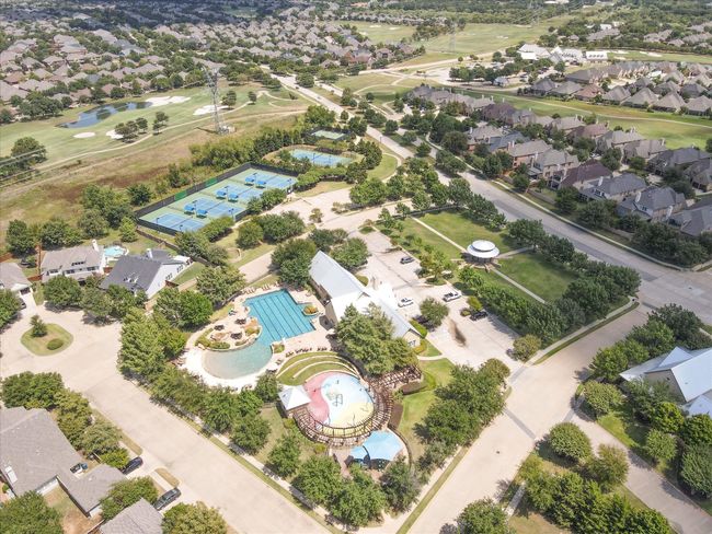Aerial perspective of suburban area with a nearby body of water and a golf club | Image 38