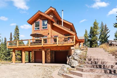 Front facade of property featuring a garage and deck | Image 3