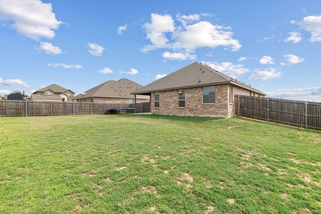 View of yard with a fenced backyard | Image 24