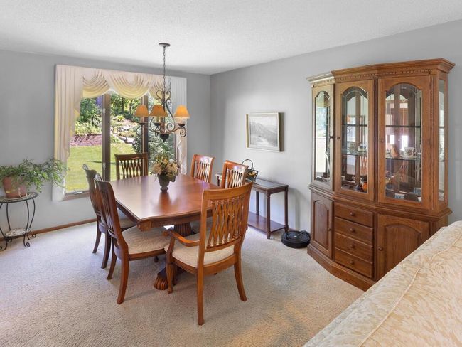 The Dining room is open to the Living room making it perfect for hosting | Image 11