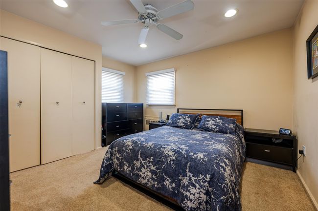 Bedroom with carpet flooring, a closet, ceiling fan, and recessed lighting | Image 13