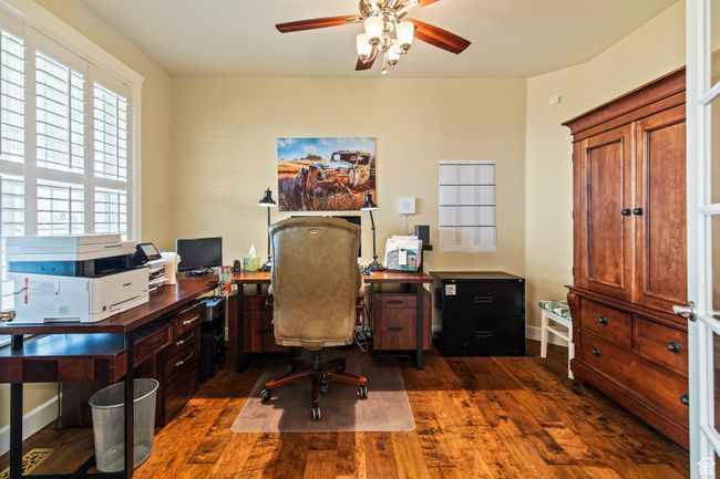 Home office featuring ceiling fan and dark wood-type flooring | Image 21