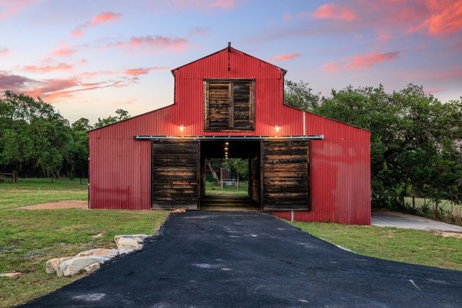 View of outbuilding with asphalt driveway | Image 38