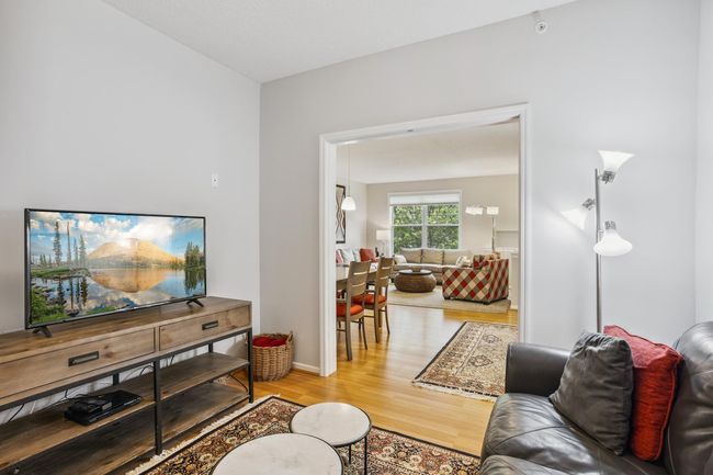 View of Dining Area and Living Room from Den | Image 10