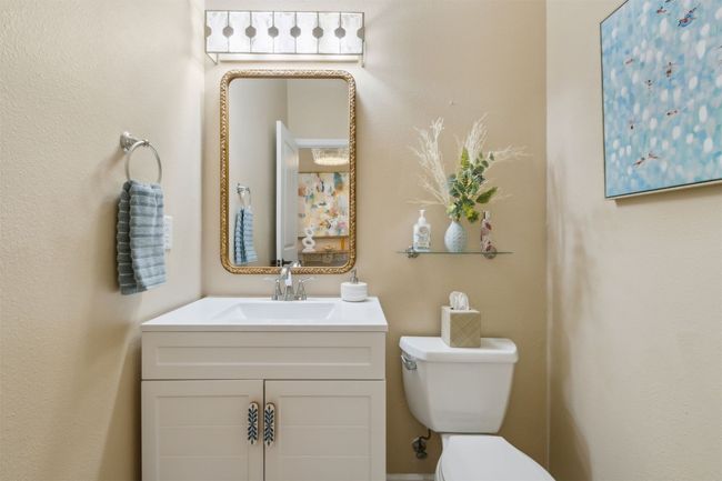 Stylish powder room on the main floor for guests. | Image 13