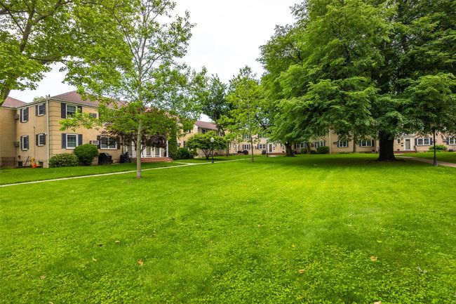 View of community featuring a lawn | Image 18