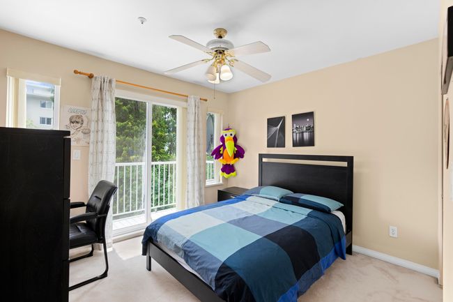 Bedroom with carpet flooring and ceiling fan | Image 23