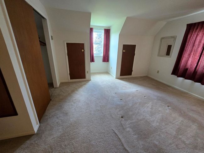 Additional living space featuring light colored carpet and baseboards | Image 4