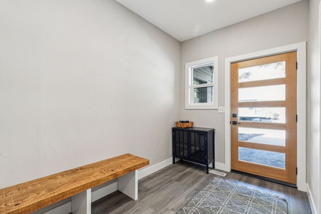 Mudroom featuring wood finished floors and baseboards | Image 11