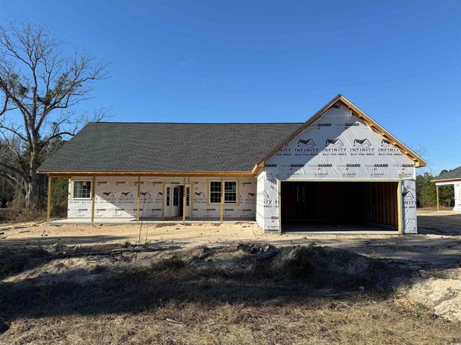 Property under construction featuring covered porch | Image 22