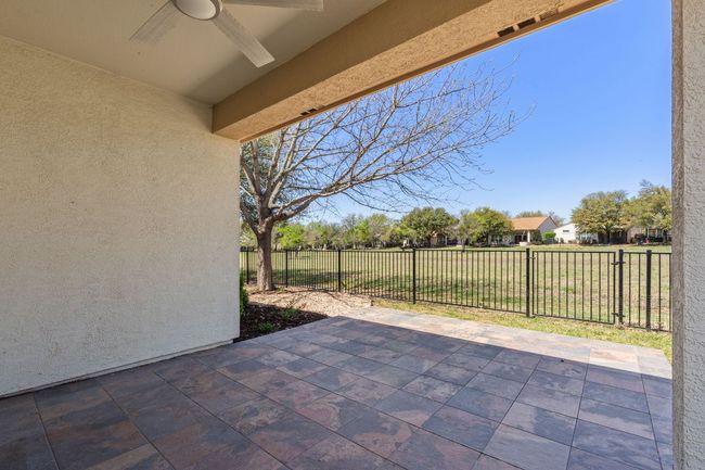 View of patio with fence and a ceiling fan | Image 32