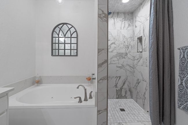 Jacuzzi soaking tub with beautiful updated shower | Image 20