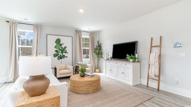 Living area with baseboards, light wood-style flooring, and recessed lighting | Image 5