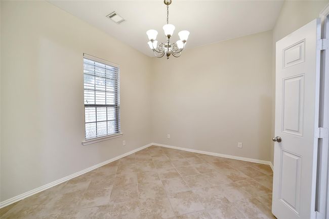 This room overlooks the front of the home and is designed for more formal affairs. | Image 11