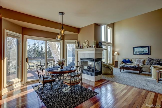 Breakfast nook with sliding door to your Trex deck and floor to ceiling windows letting in the sunshine | Image 16