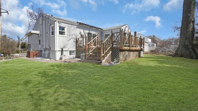View of yard with a wooden deck | Image 29