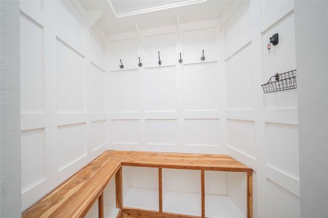 Mudroom featuring a decorative wall | Image 17
