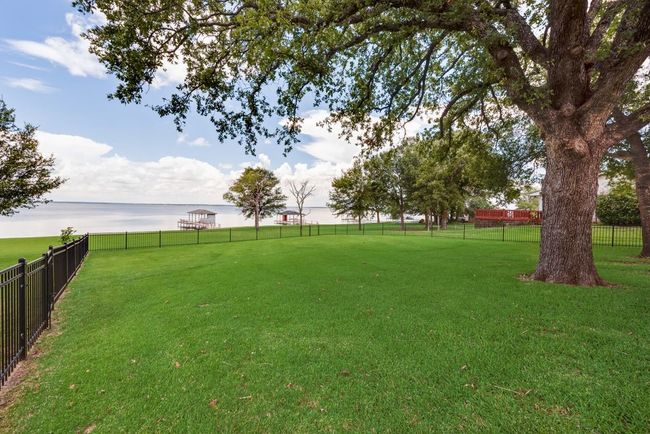 The large shaded yard is fenced in to keep the kids and pups contained! | Image 30
