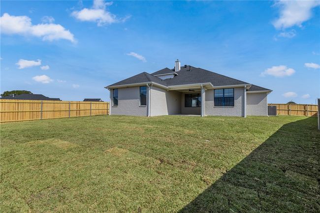 Rear view of house with a lawn | Image 31