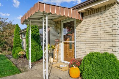 Cement sidewalk and covered level entry. | Image 2