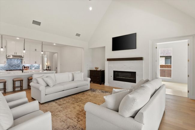Gas fireplace and wood stained mantle make a beautiiful focal point in the room. | Image 11