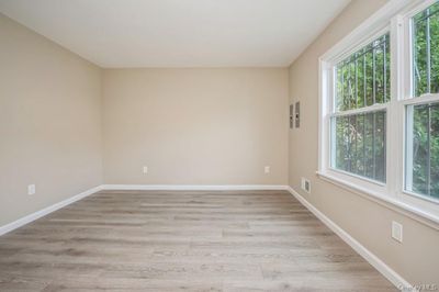 Unfurnished room with light wood-type flooring | Image 3