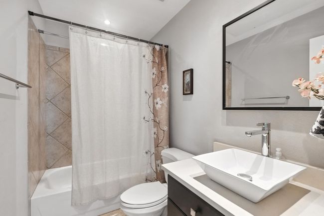 Bathroom with vanity and shower / bath combo | Image 24