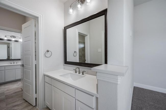 Full bath with two vanities and baseboards | Image 29